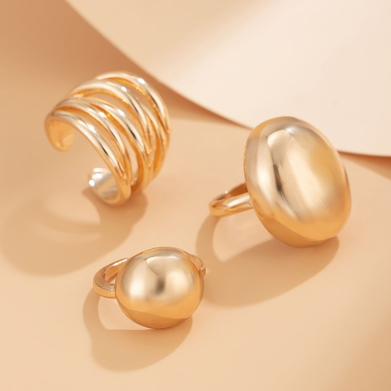 Набор массивных золотистых колец обтекаемой формы 1J11861CJJ