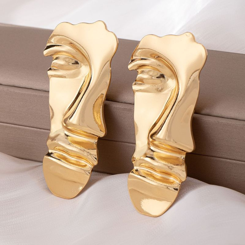 Длинные золотистые серьги из ювелирного сплава в форме абстрактных лиц 1DNS11100CJJ