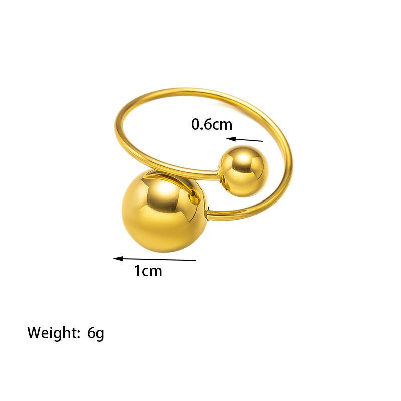 Золотистое разомкнутое кольцо с двумя металлическими сферами 1J12351CJJ Золотистое разомкнутое кольцо с двумя металлическими сферами 1J12351CJJ