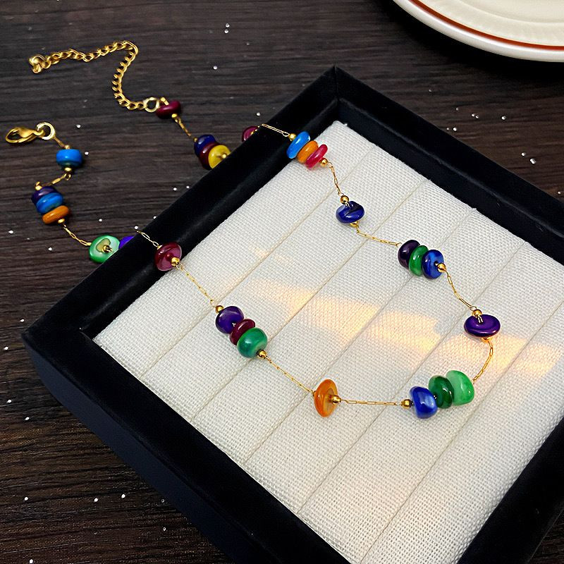 Длинные бусы из разноцветного камня с золотистыми вставками CJM18312 Длинные бусы из разноцветного камня с золотистыми вставками CJM18312