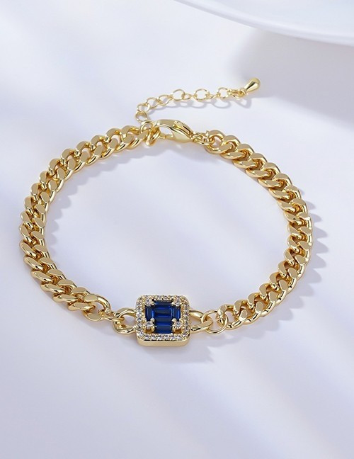 Золотистый браслет-цепь с синим кристаллом G41429