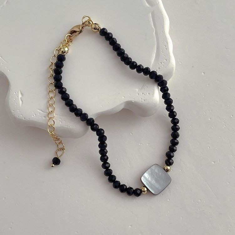 Длинные черные бусы с центральным серебристым диском J11257CJJ Длинные черные бусы с центральным серебристым диском J11257CJJ