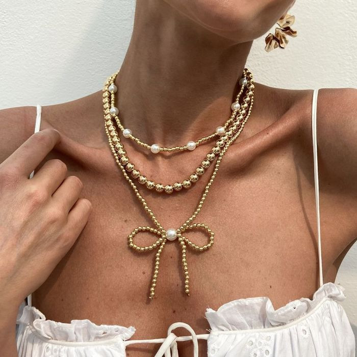 Жемчужное многослойное колье с крупным декоративным бантом CJL23014