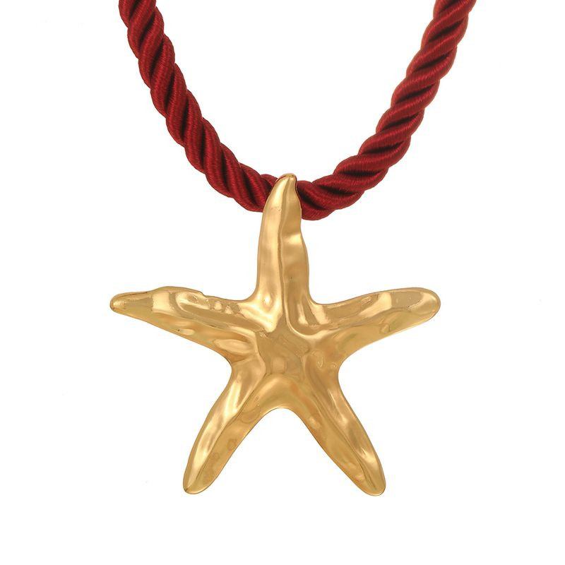 Длинные бусы со шнурком и крупной золотистой звездой CJM18770