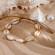 Браслет на нити с натуральными ракушками и золотистыми бусинами CJL40598