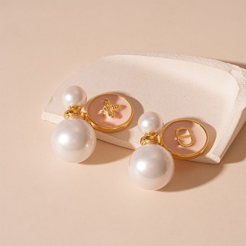 Серьги шарики из золотистой меди с жемчугом и розовой эмалью 1J11800CJJ