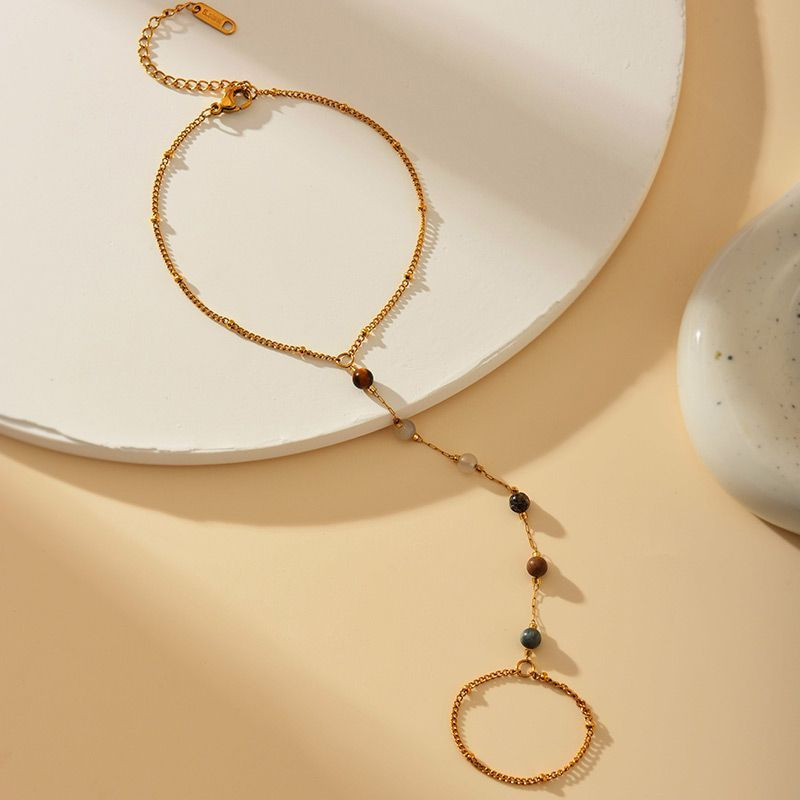 Слейв-браслет гранатовые искры на золотом фоне Слейв-браслет гранатовые искры на золотом фоне