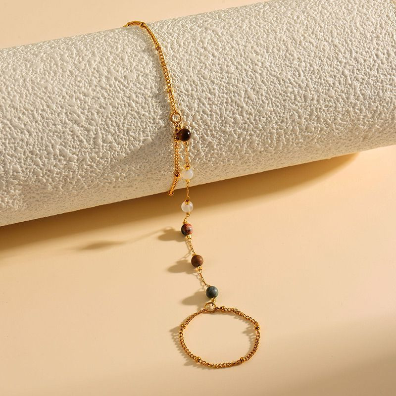 Слейв-браслет гранатовые искры на золотом фоне Слейв-браслет гранатовые искры на золотом фоне