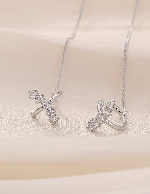 Серьги-протяжки с переплетением и камнями M10571