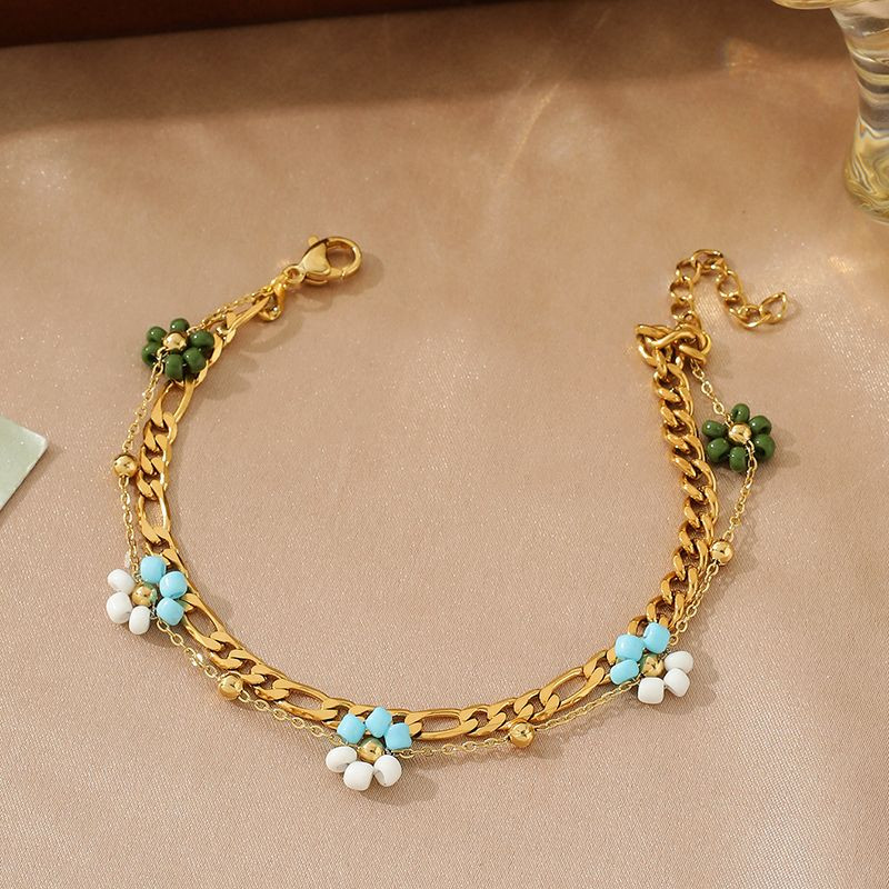 Браслет многослойный с голубыми бусинами и цветами CJN36802