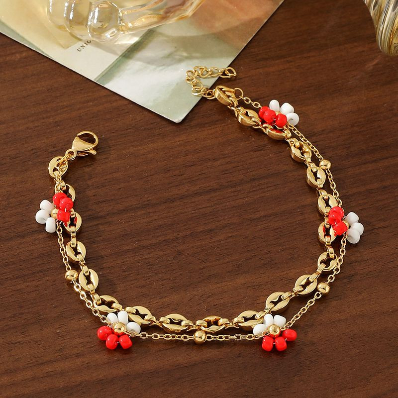 Браслет многослойный с голубыми бусинами и цветами CJN36802