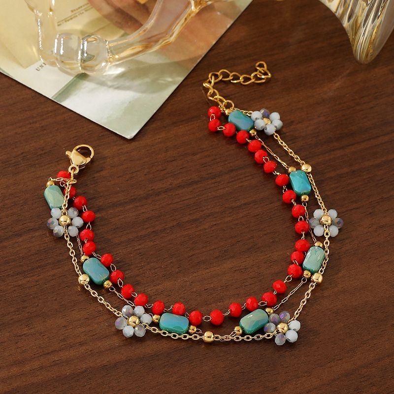 Браслет многослойный с голубыми бусинами и цветами CJN36802