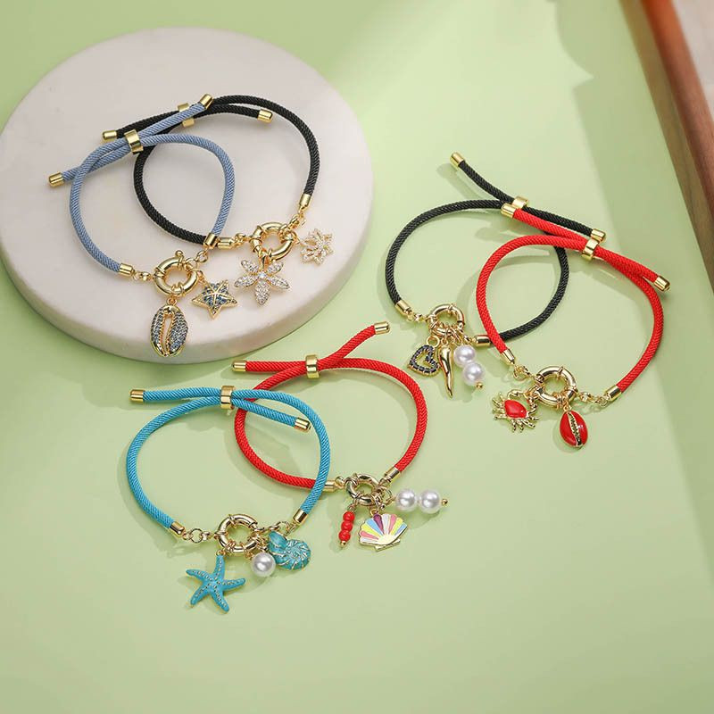 Браслет нить с золотистым крабом и красной вставкой CJQ96971