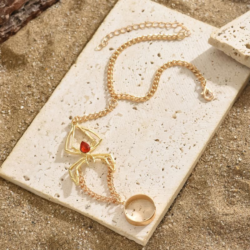 Слейв-браслет золотая паутина с кристальным сердцем CJF59379