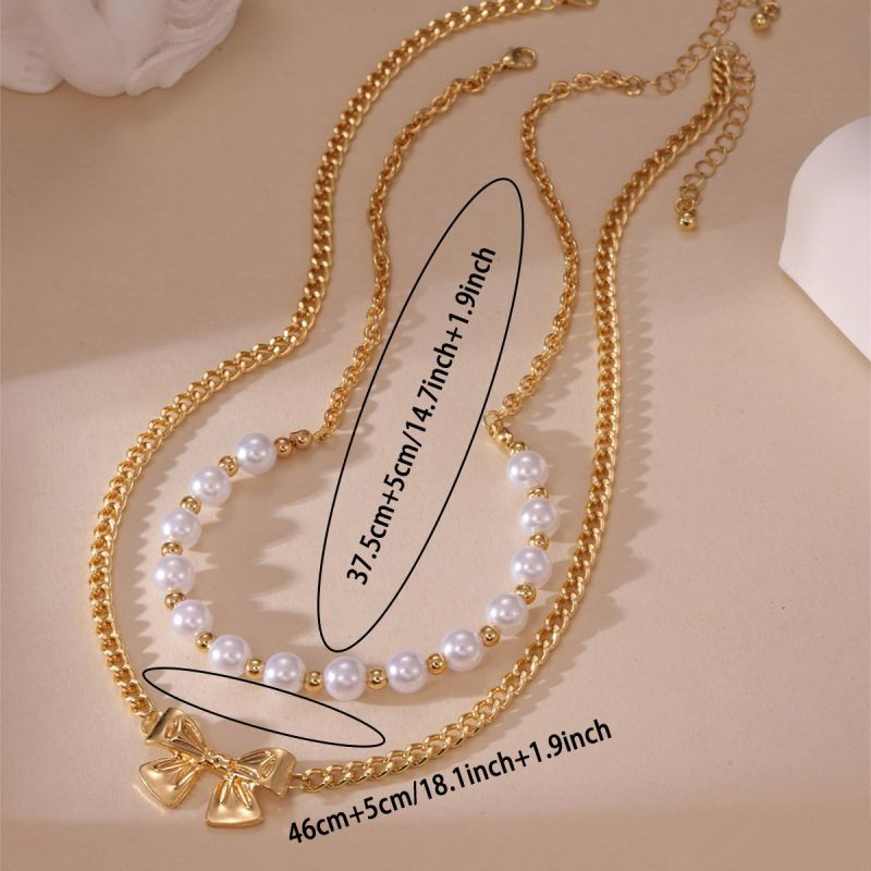 Двойное колье из жемчуга с подвеской-бантиком CJP62250