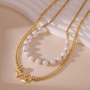 Двойное колье из жемчуга с подвеской-бантиком CJP62250 Двойное колье из жемчуга с подвеской-бантиком CJP62250