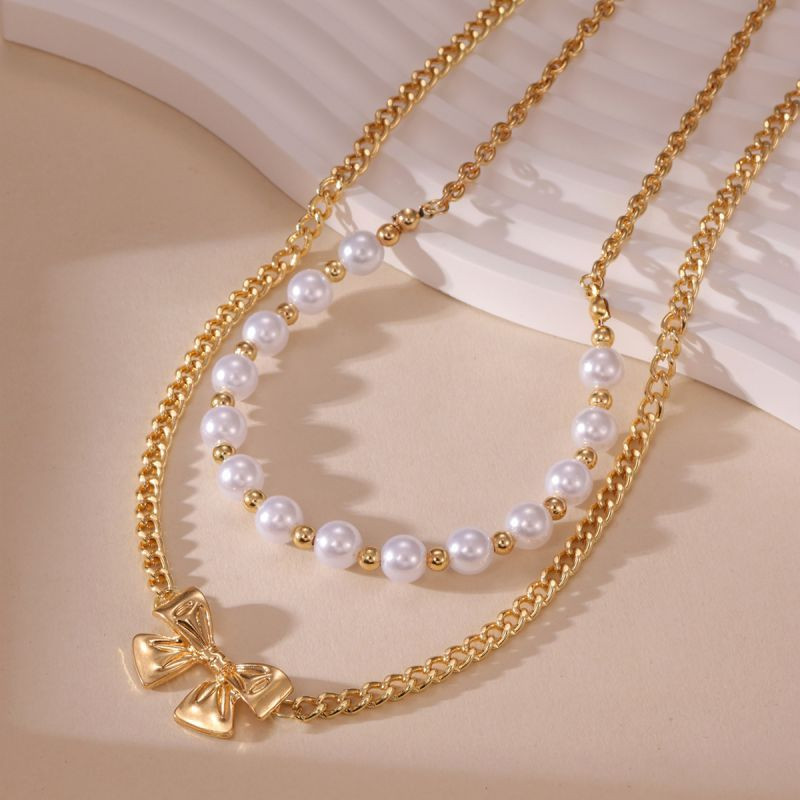 Двойное колье из жемчуга с подвеской-бантиком CJP62250