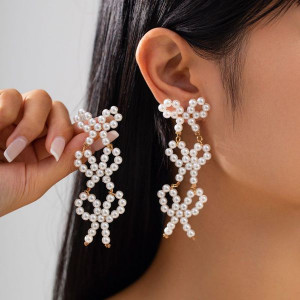 Длинные вечерние серьги из трех жемчужных бантов CJL50429 Длинные вечерние серьги из трех жемчужных бантов CJL50429