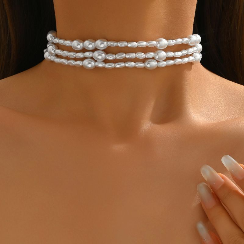 Трехрядный жемчужный чокер с круглыми перемычками CJT17371