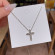 Серебристое колье с крестом из бриллиантов CJX87450