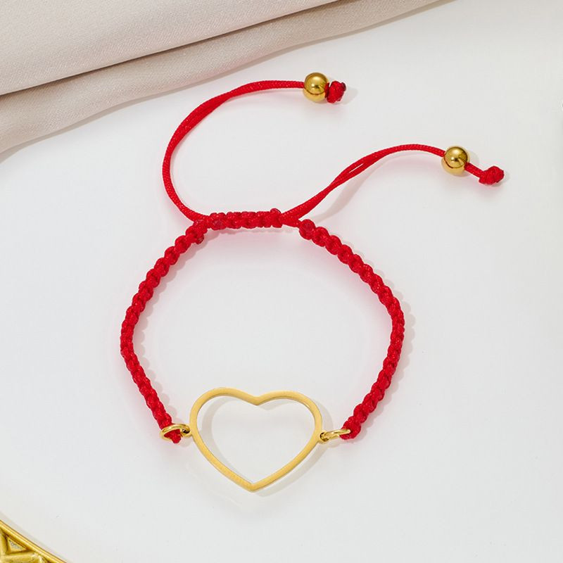 Браслет плетеная нить с серебристым контуром сердца CJQ65906