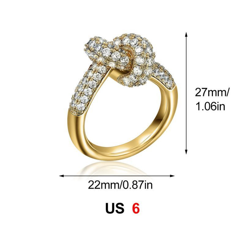 Золотистое кольцо с узлом и дорожкой кристаллов CJS97515