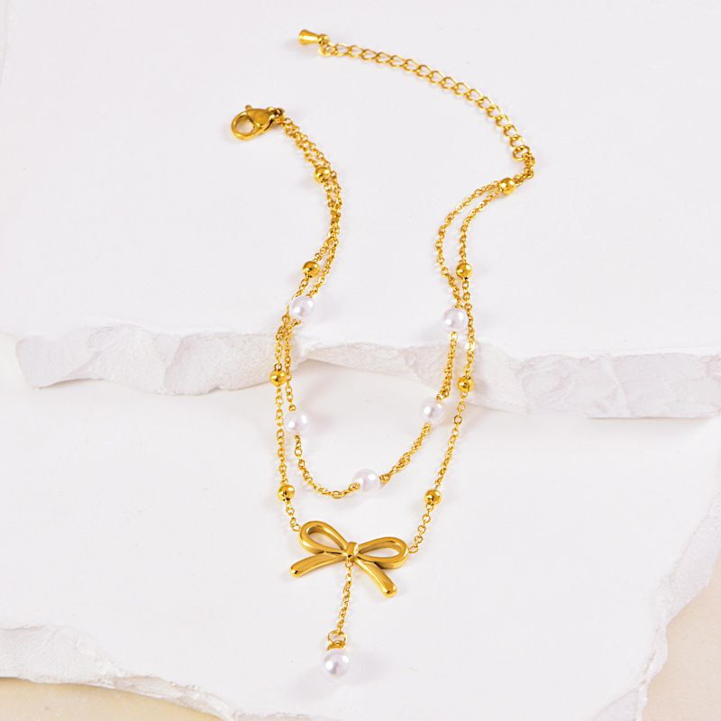 Браслет многослойный с бантом и жемчужными бусинами CJL34039