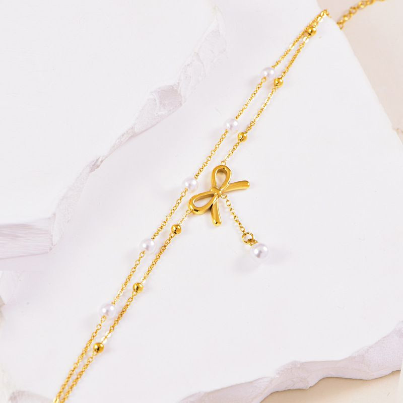 Браслет многослойный с бантом и жемчужными бусинами CJL34039