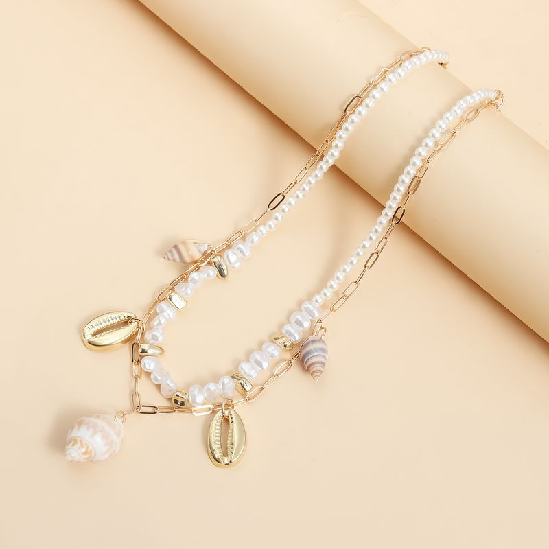 Мульти-цепочка с жемчугом и раковиной 1J11877CJJ Мульти-цепочка с жемчугом и раковиной 1J11877CJJ