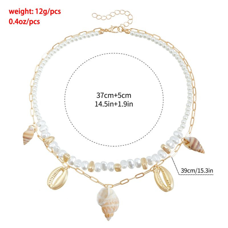 Многослойная цепочка с жемчугом и подвеской-раковиной 1J11877CJJ