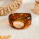 Коричневый браслет из смолы с цветком CJZ36440