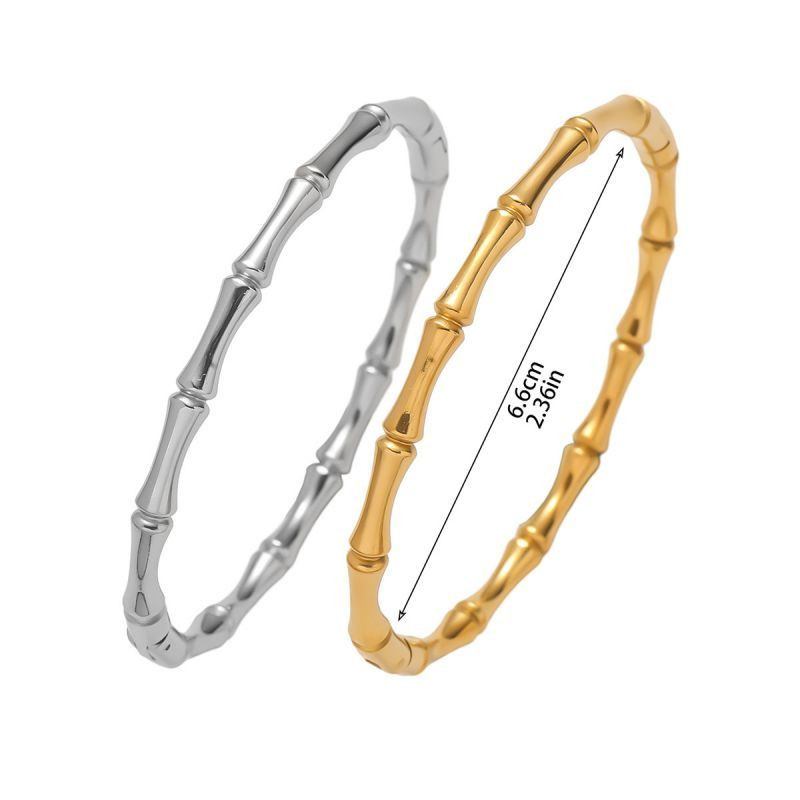 Браслет жесткий витой из серебристого металла CJH12781