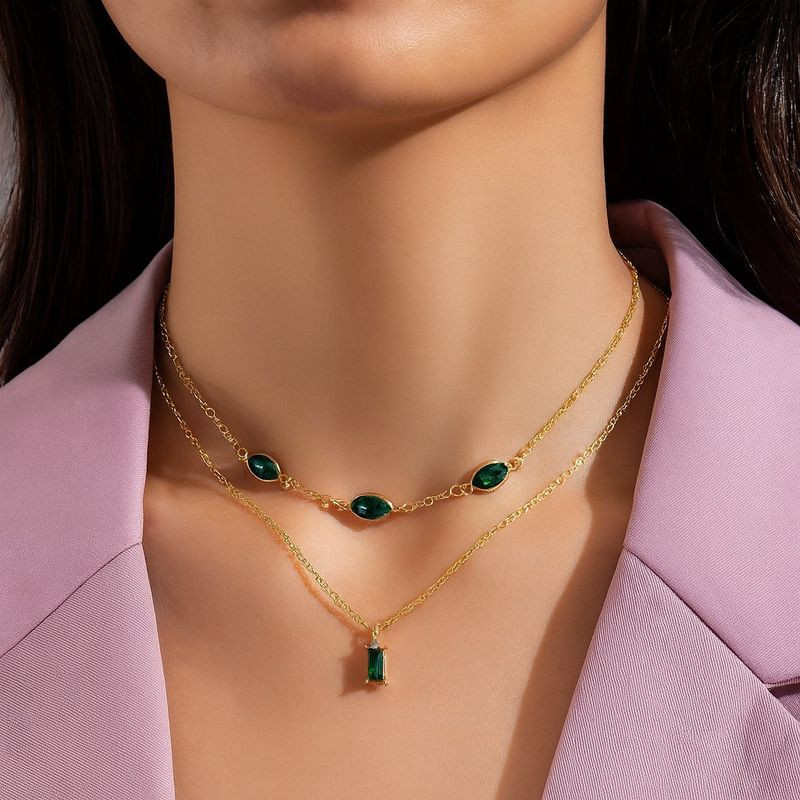 Двойное золотистое колье с изумрудными вставками 1J12440CJJ