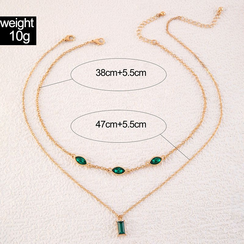 Двойное золотистое колье с изумрудными вставками 1J12440CJJ