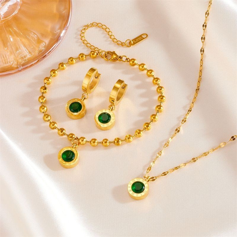 Золотистые серьги-конго с изумрудным камнем CJG69118