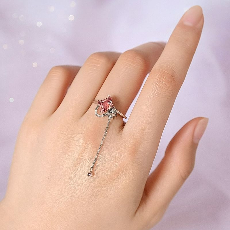 Фантазийное кольцо с розовым камнем и подвеской-шариком 1J11922CJJ