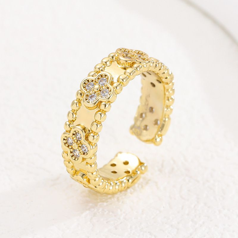 Разомкнутое кольцо с клевером и фактурным краем 1J12070CJJ