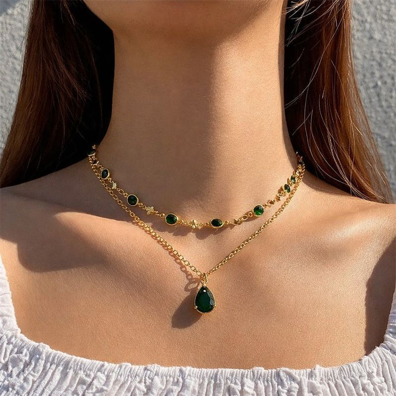 Двойное золотистое колье с зелеными подвесками 1J12442CJJ