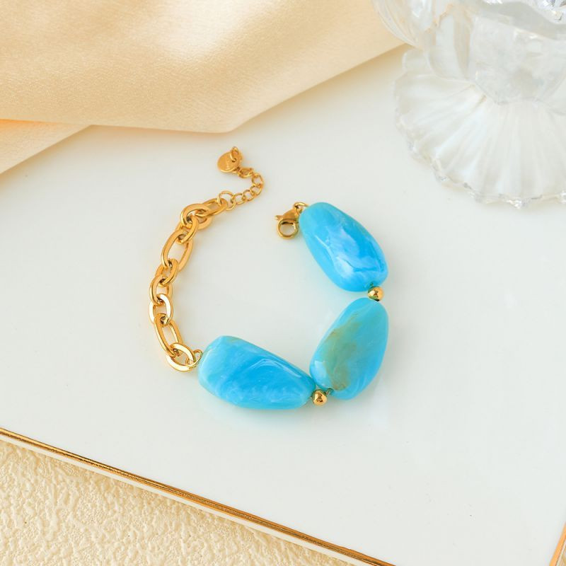 Браслет золотистый с крупными вставками под янтарь CJP93460 Браслет золотистый с крупными вставками под янтарь CJP93460