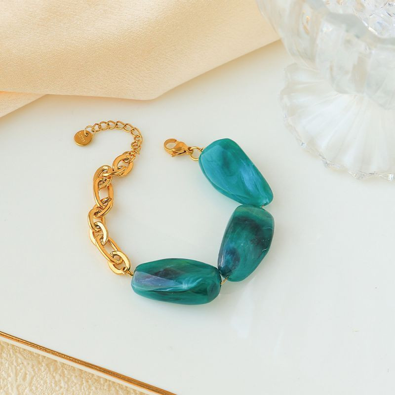 Браслет золотистый с крупными вставками под янтарь CJP93460 Браслет золотистый с крупными вставками под янтарь CJP93460