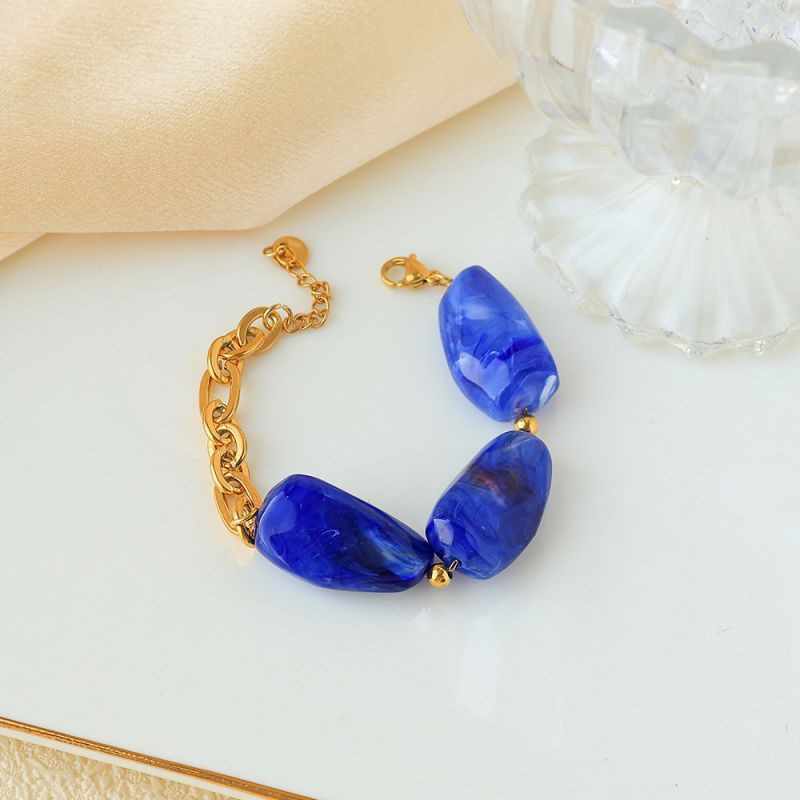 Браслет золотистый с крупными вставками под янтарь CJP93460 Браслет золотистый с крупными вставками под янтарь CJP93460