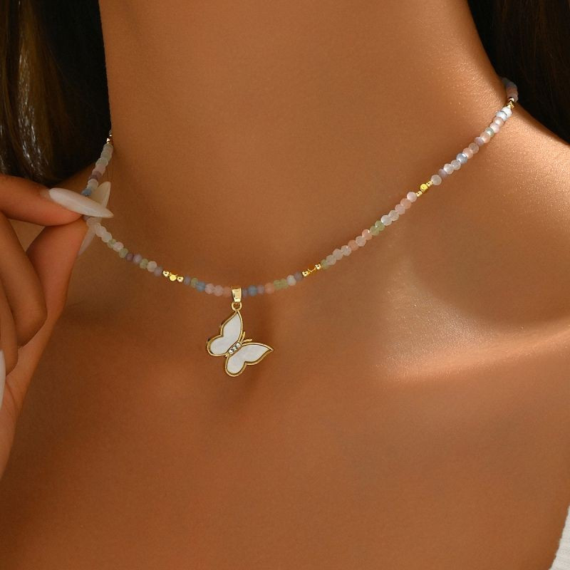 Чокер из бусин с подвеской-бабочкой из перламутра CJG30596 Чокер из бусин с подвеской-бабочкой из перламутра CJG30596