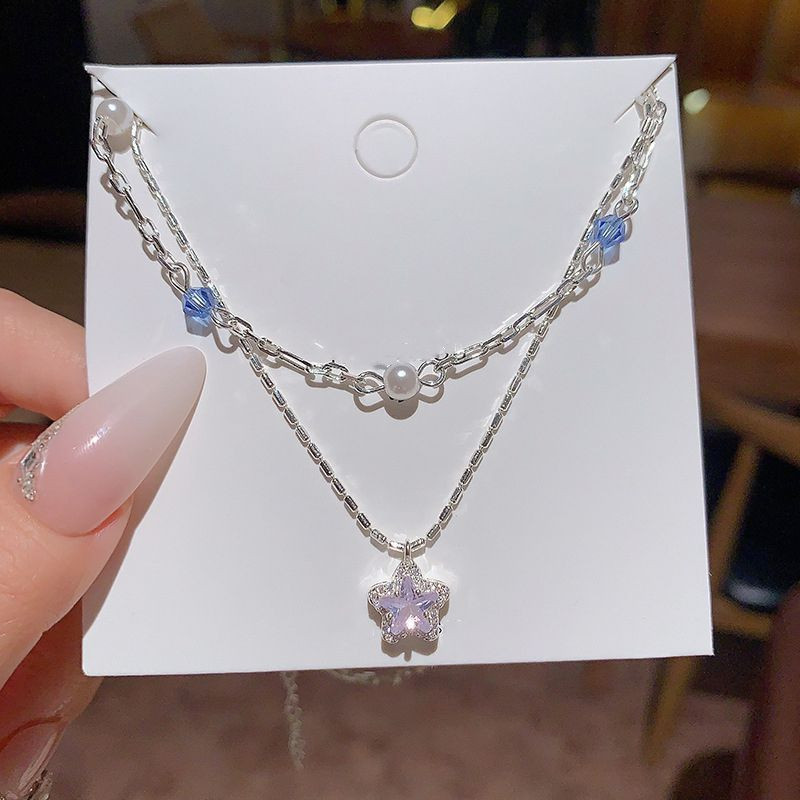 Серебристое колье со звездой и синими бусинами CJX87508