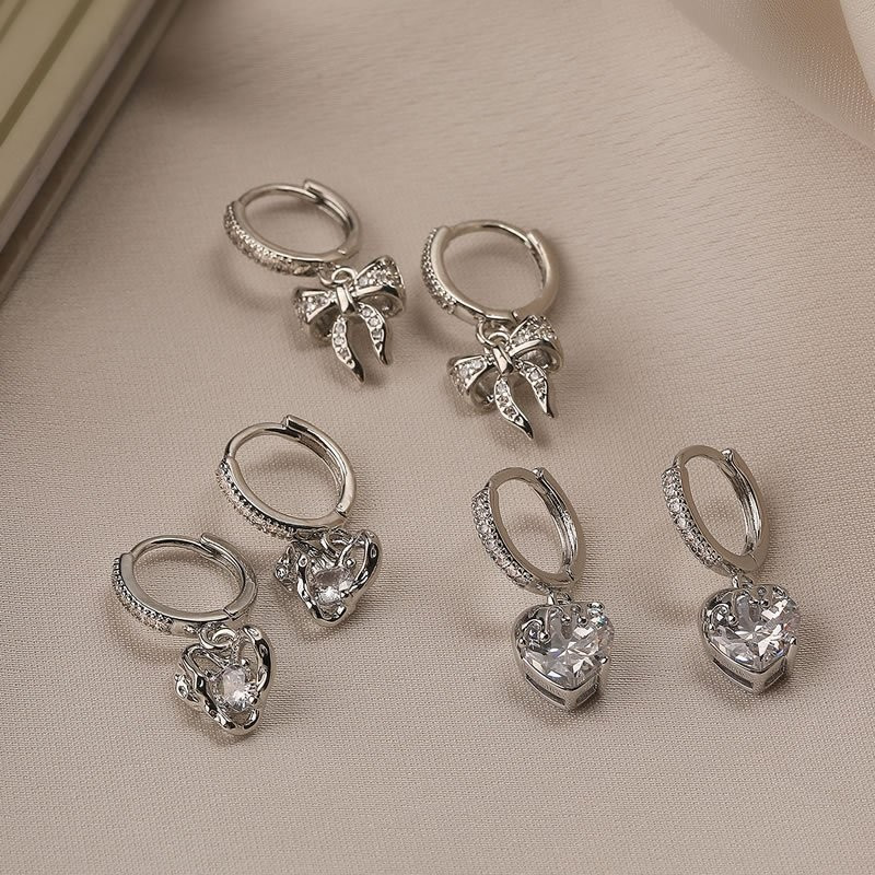 Серебристые серьги-кольца с гранеными сердцами N99072 Серебристые серьги-кольца с гранеными сердцами N99072