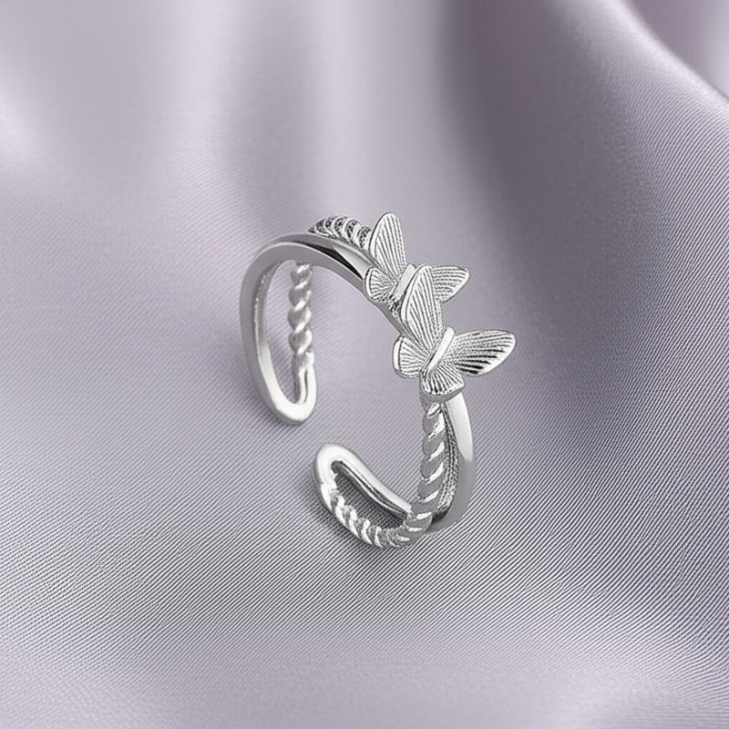 Кольцо с силуэтами бабочек и фианитами 1J11928CJJ Кольцо с силуэтами бабочек и фианитами 1J11928CJJ