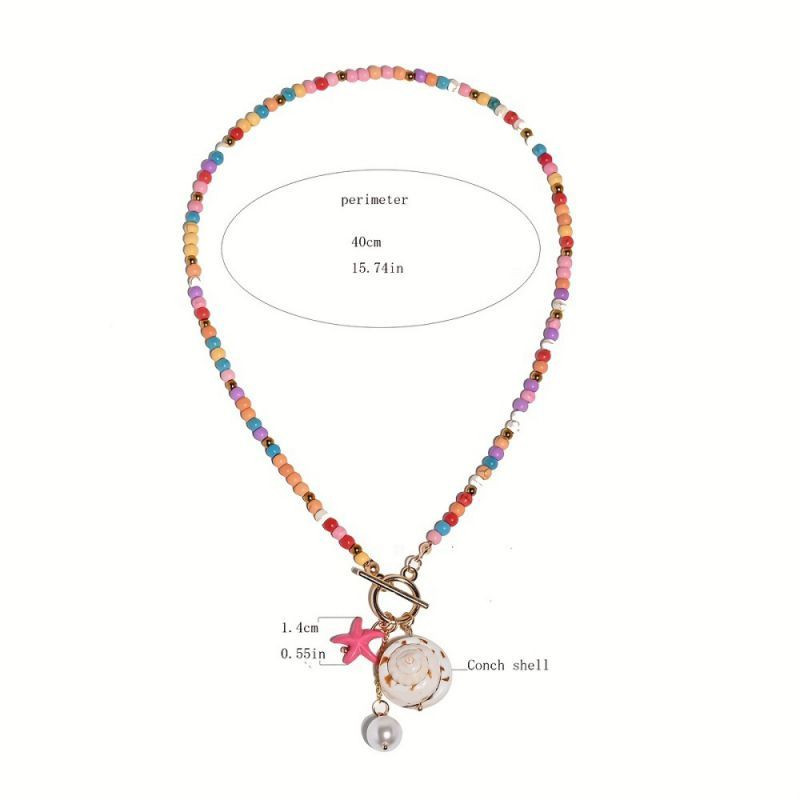 Бусы из мелкого бирюзового камня с подвеской-монетой CJP74984