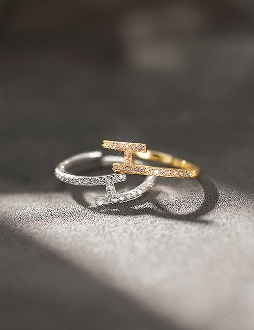 Золотистое разомкнутое кольцо с дорожками фианитов L78608