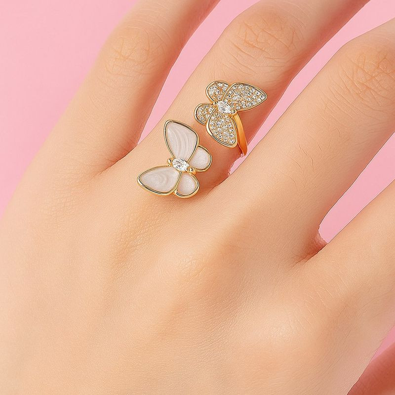 Двойное разомкнутое кольцо с парящими бабочками 1J12077CJJ Двойное разомкнутое кольцо с парящими бабочками 1J12077CJJ