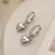 Серебристые серьги-кольца с гладкими сердцами N99091