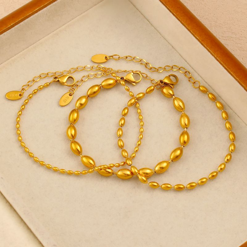 Браслет цепочка с фактурным плетением и золотистыми бусинами CJN43498